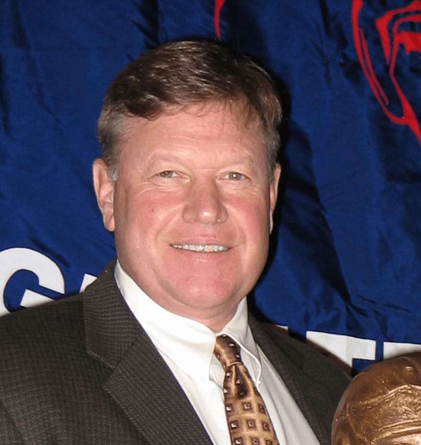 Smiling middle-aged man in suit and tie