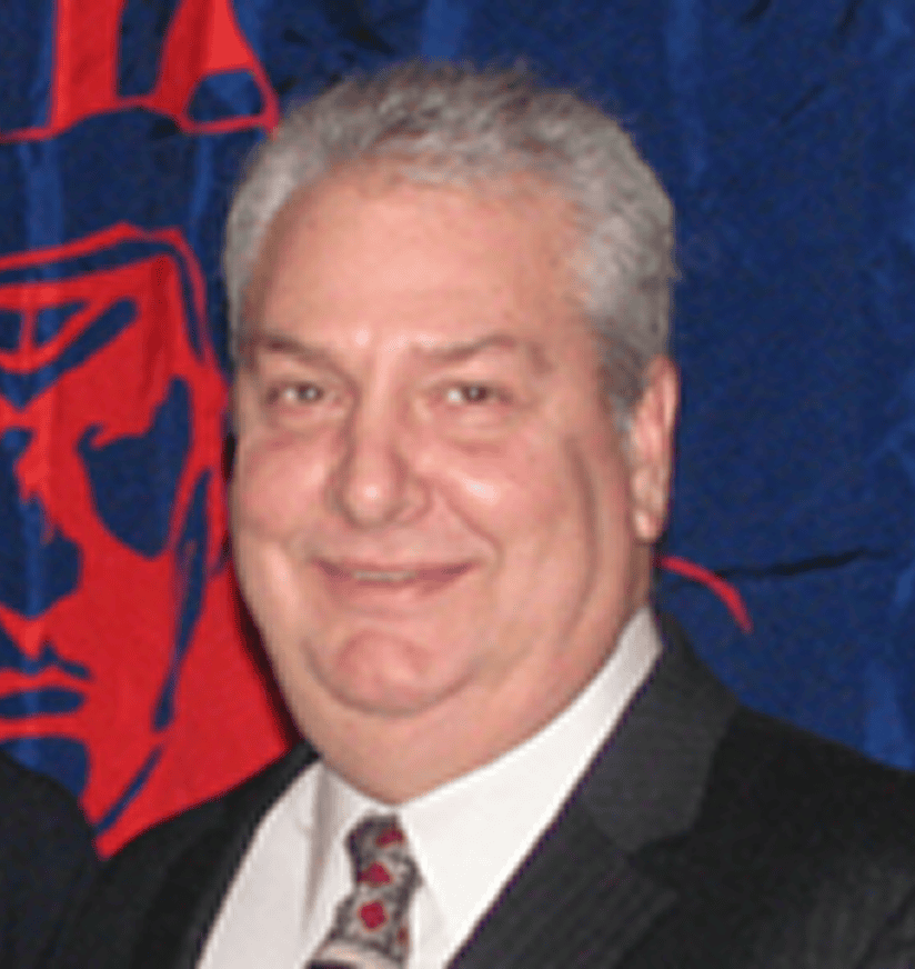 Smiling gray-haired man in suit and tie