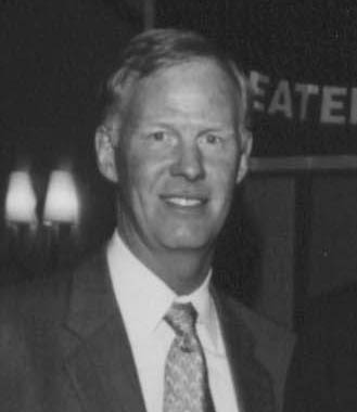 Smiling man in suit and tie