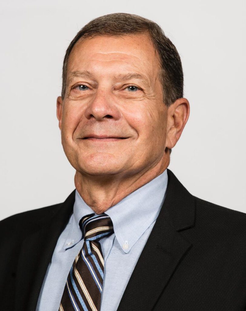 Smiling middle-aged man in suit and tie