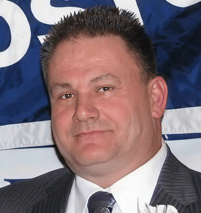 Close-up portrait of man in suit and tie